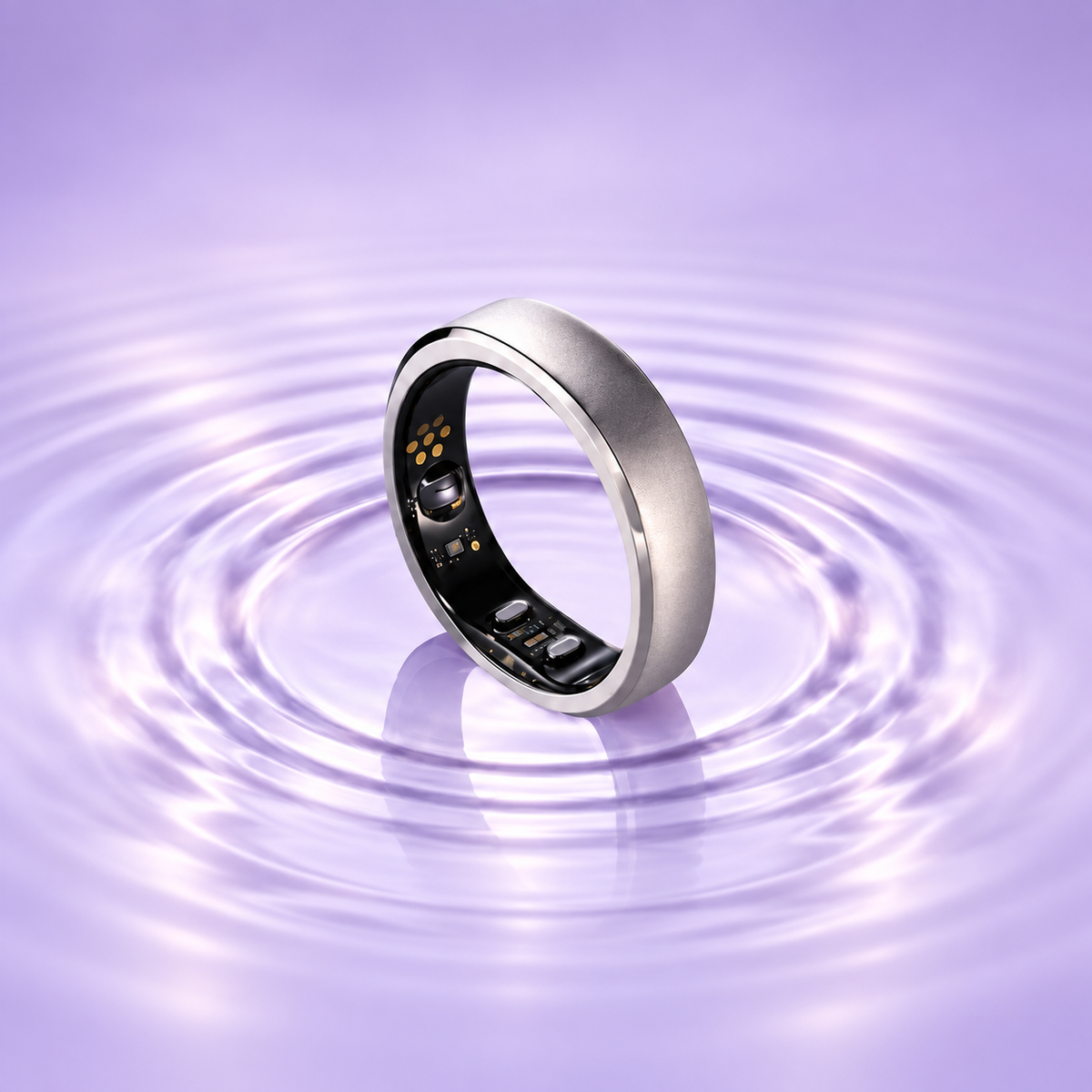 Silver smart ring over soft lavender water ripples