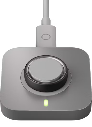 Smart ring on a charging dock with USB-C cable
